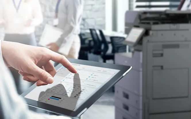 Kyocera printer being serviced by technician