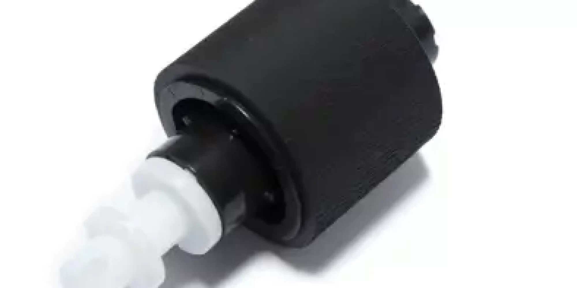 Photo of a worn printer roller with reduced grip, causing paper jams.